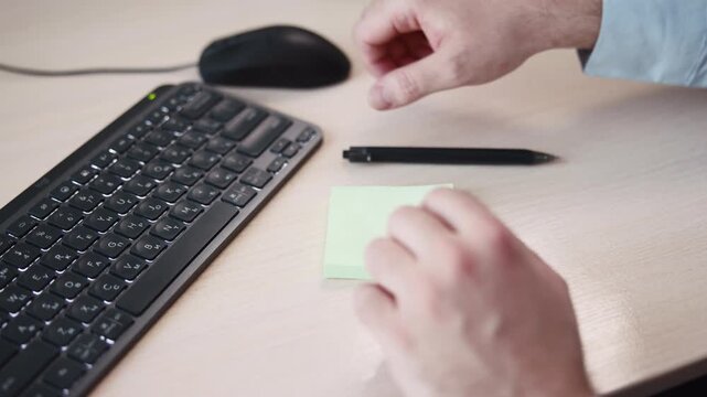 Calm Office Environment Showing Detailed Hand Positioning And Recording Of Financial Information. Media
