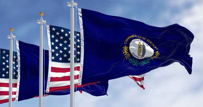 Kentucky state flag and the American flag waving in the wind on a clear day. Southeastern state of the United States. Democracy and identity. 3d illustration render. Fluttering fabric.