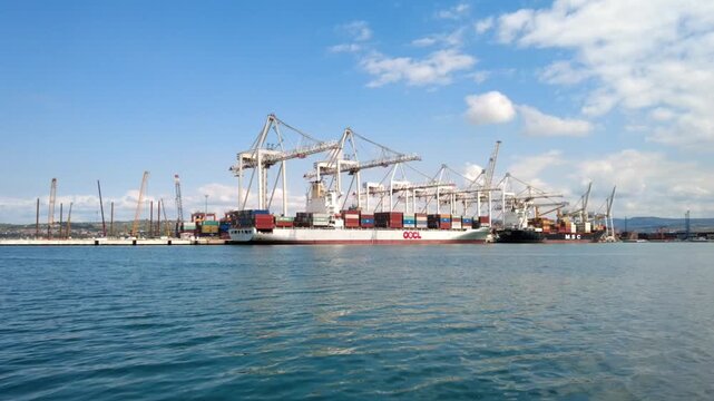 Extended harbor timelapse with service boats near OOCL ship