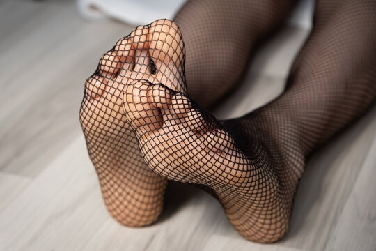 Female webcam model soles in a fishnets