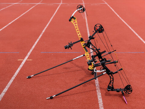 Archery. Professional compound bows. Competition field. Track lines. Archery arena. The composite bows is placed on a stands. Equipment for archery. Sports concept