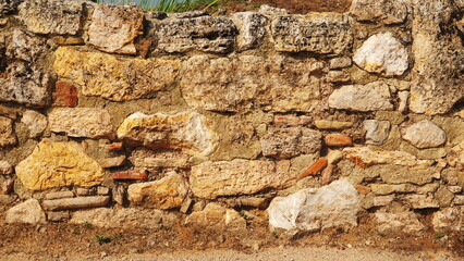 Fototapeta premium Weathered Stone Wall Texture Background