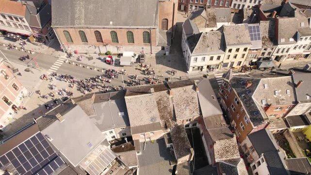 Aerial View of Crowd Gathering in Beaumont Historic Town Square Before Local Parade, People Assembling Near Church and Streets - Drone Shot