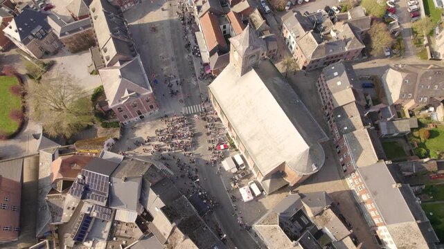 Crowd Gathering Around Church Square During Village Event In Small European Town, Aerial Top Down View &ndash; Drone Shot
