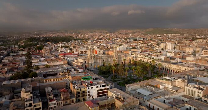 Aerial approach toward impressive Basilica Cathedral of Arequipa the White City