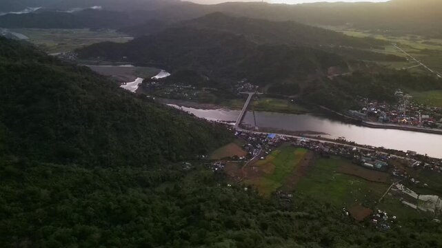 Picturesque aerial overview of Bato River in Catanduanes, Bicol, Philippines with mountain terrain and rural landscape