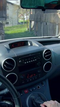 Person POV while un-parking the car and driving