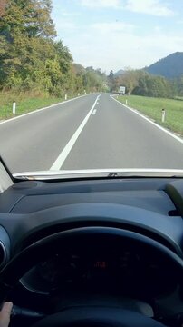 Person POV of driving car in countryside