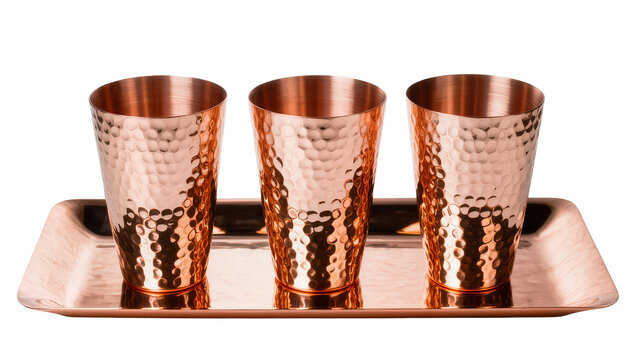 Three hammered copper Moscow Mule mugs on copper tray