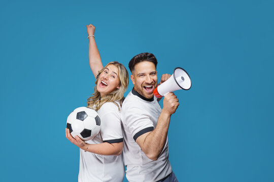 soccer fans with megaphone and soccer ball in hand celebrating on isolated on free background