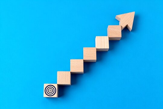 Wooden blocks arranged as an upward arrow