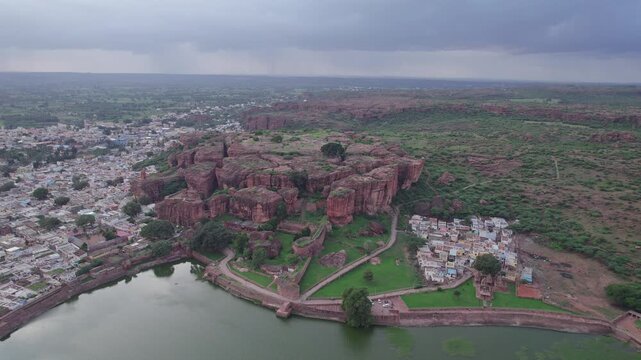 Drone view of Agastya Lake beside Badami Caves with scenic surroundings
