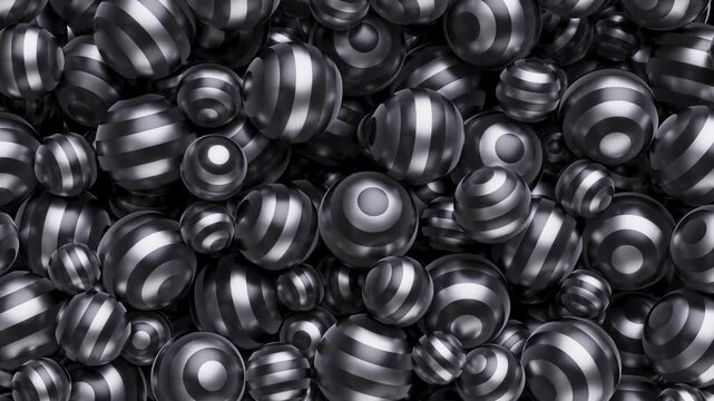 Animated flowing lines on spheres, like a hypnotic pattern. A cluster of shiny, striped spheres fills the frame, creating a dynamic and textured visual pattern.