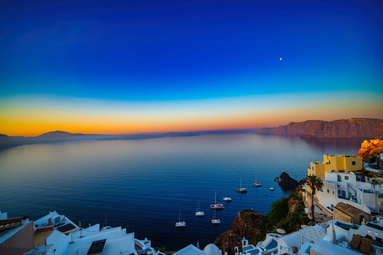 Golden dawn over Oia and the Santorini caldera