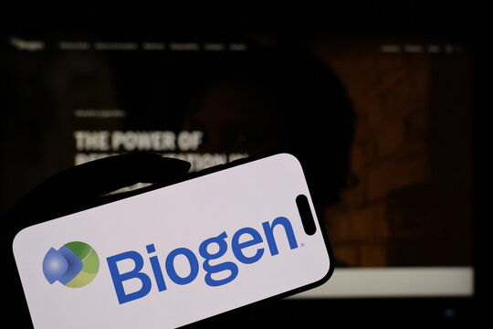 Kiel, Germany - 05-20-2026: Smartphone displaying US biotechnology company Biogen logo in front of companys webpage