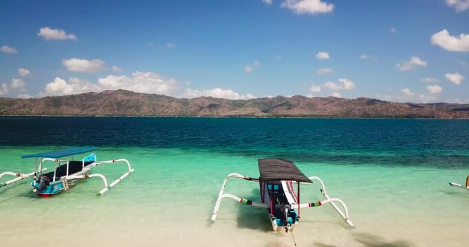 Aerial View of Traditional Outrigger Boats on a Tropical Beach in Lombok, Indonesia