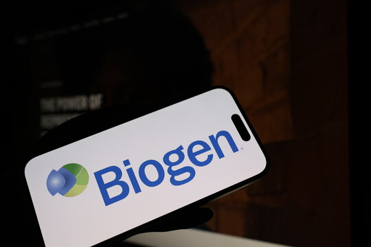 Kiel, Germany - 05-20-2026: Smartphone displaying US biotechnology company Biogen logo in front of companys webpage