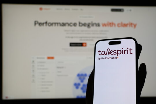 Kiel, Germany - 05-20-2026: Smartphone displaying French collaboration software company Talkspirit logo in front of companys webpage