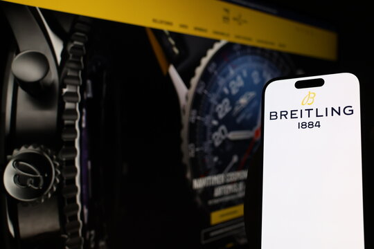 Kiel, Germany - 05-20-2026: Smartphone displaying Swiss luxury watch company Breitling logo in front of companys webpage