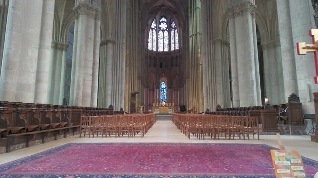 Interior of Gothic Cathedral with Soaring Columns and Stained Glass Windows - Cinematic Footage