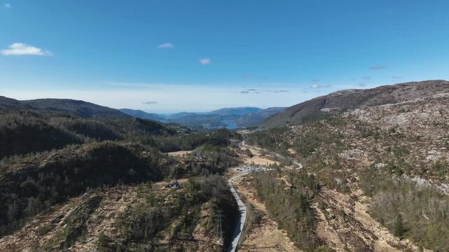 Fv360 through Bruvikdalen toward Storavatnet on Osteroy Norway during sunny spring day