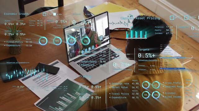 Woman starting remote call at table using laptop and finance charts while animated data updating