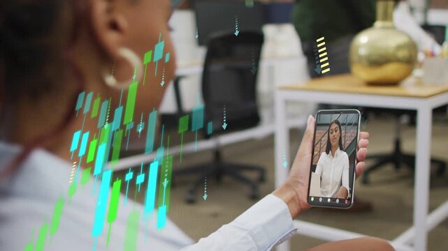 Seated woman holding phone receiving finance update, candlestick overlay densifying, obscuring view