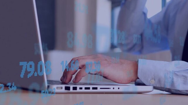 Mature man typing on laptop beside window, blue stock numbers animating to support finance analysis