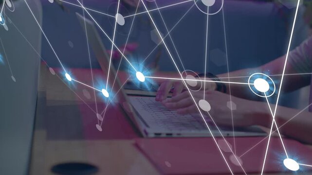Man typing on laptop, initiating data network visuals showing flow, growing over keys and phone