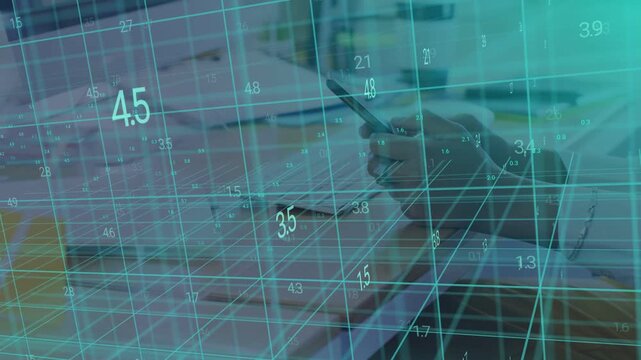Office worker's hand entering frame, tapping phone, analyzing business grid and numbers over desk