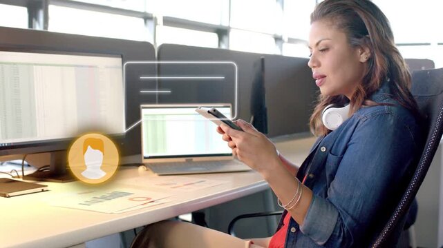 Woman tapping phone swiping tablet showing chat bubble near monitor while reviewing business charts