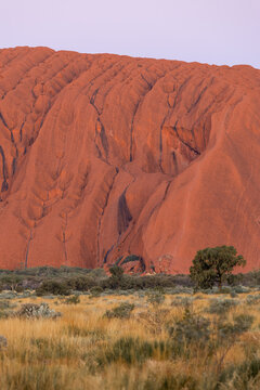 Close-up view of Uluru rock at sunset time.