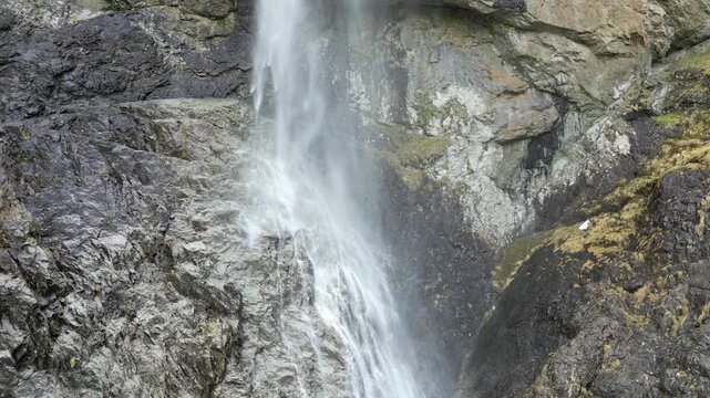 Close Static View of Waterfall Crashing Into Rocks