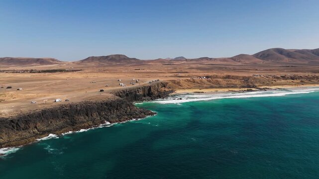 Aerial Orbit of Playa del Castillo Beach and Coastline in El Cotillo Fuerteventura Spain