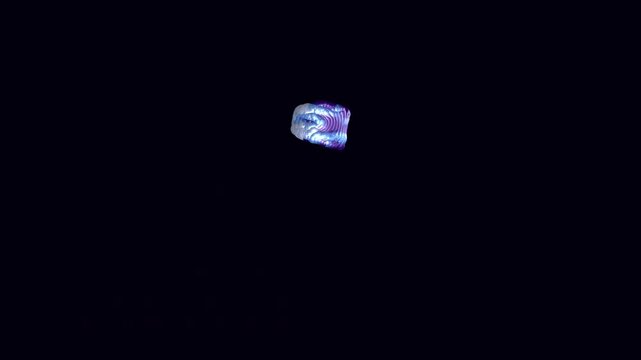 Topographic hypercube structure with iridescent pearl details collapses into a vortex seamless loop on dark background. Echoing ripple rings lighting. Upper third composition. Generative code art.