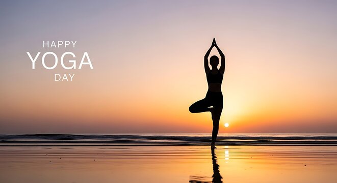 Silhouette of a woman in yoga tree pose on a beach at sunset