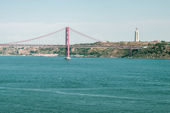 25 de Abril Bridge and Cristo Rei Across the Tagus River in Lisbon