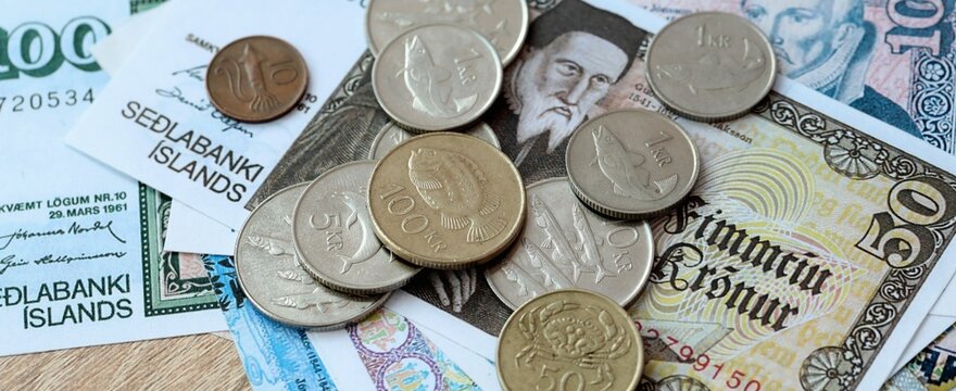 Icelandic krona money bills and coins on table. Iceland cash of ISK currency close up