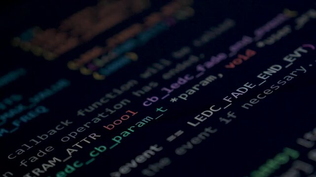 Coding programs on black screen background.