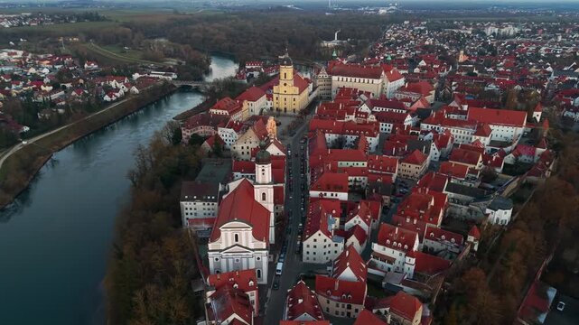 Beautiful drone shot of Neuburg an der Donau medieval old town. Scenic aerial perspective of Amalienstrasse, historic landmarks, traditional architecture, and the peaceful Danube river bend.