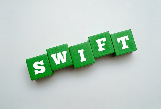 Colorful block with text SWIFT. SWIFT acronym for SOCIETY FOR WORLDWIDE INTERBANK FINANCIAL TELECOMMUNICATION