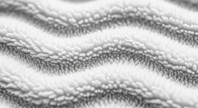 Macro photograph showing the intricate details of a luxurious white fleece fabric featuring a thick pile and gentle wavy fiber patterns, neutral, sherpa, layered
