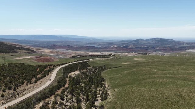Wide aerial of winding mountain pass in Vernal Utah US highway 191