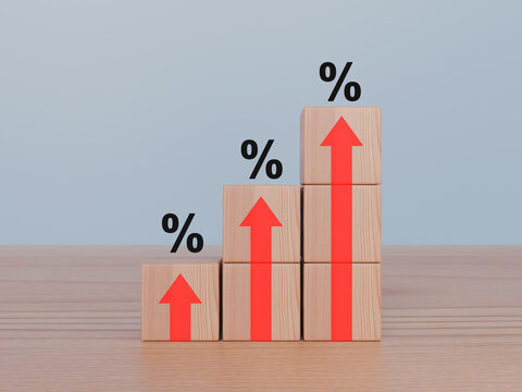 Wooden blocks with red arrow up and percentage sign, Interest rate finance and mortgage rates concept