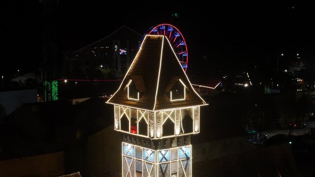 Night View Of Capivari Village In Campos Do Jordao In Sao Paulo Brazil. Illuminated Ferris Wheel. Downtown Cityscape. European Architecture. Capivari Village In Campos Do Jordao In Sao Paulo Brazil. 