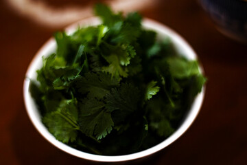 Fresh Plucked Coriander Leaves In A Small Bowl