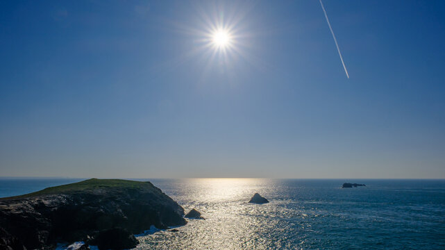 Island of the Cornish coast in dramatic sky and sea