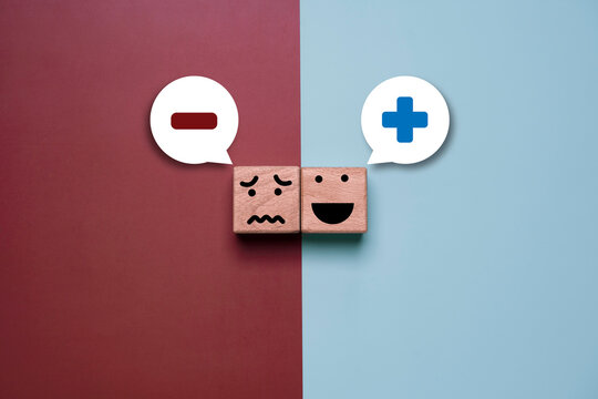 Positive and negative mindset concept with happy and unhappy emotion blocks on split background. Symbol of mental attitude, emotional balance, decision making and psychology comparison.