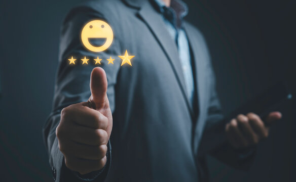 Businessman showing thumbs up with five star customer satisfaction rating and happy feedback icon. Concept of excellent service quality, positive review, trust and business success.