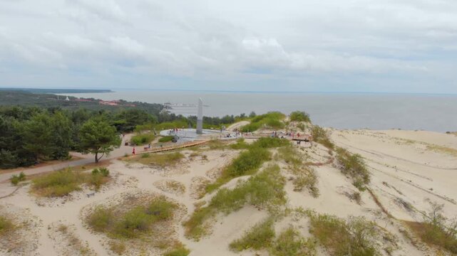 aerial birds eye view capturing the vast, wind swept drifting sand dunes of the Parnidis Dune, located in the south of Nida on the Curonian Spit peninsula in Lithuania.